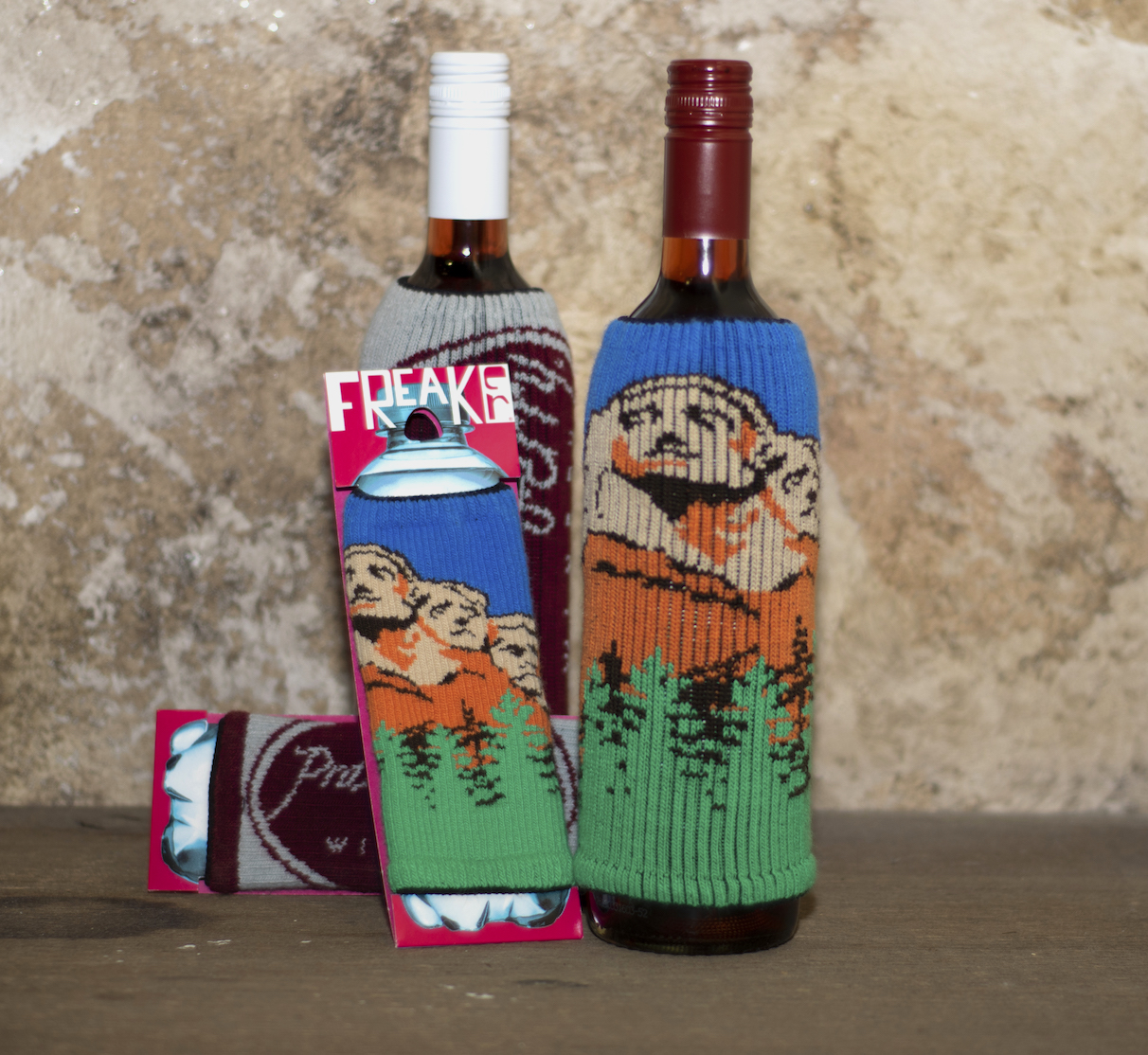 Mt Rushmore Freaker Mount Rushmore Freaker knit bottle sleeve on a bottle of wine